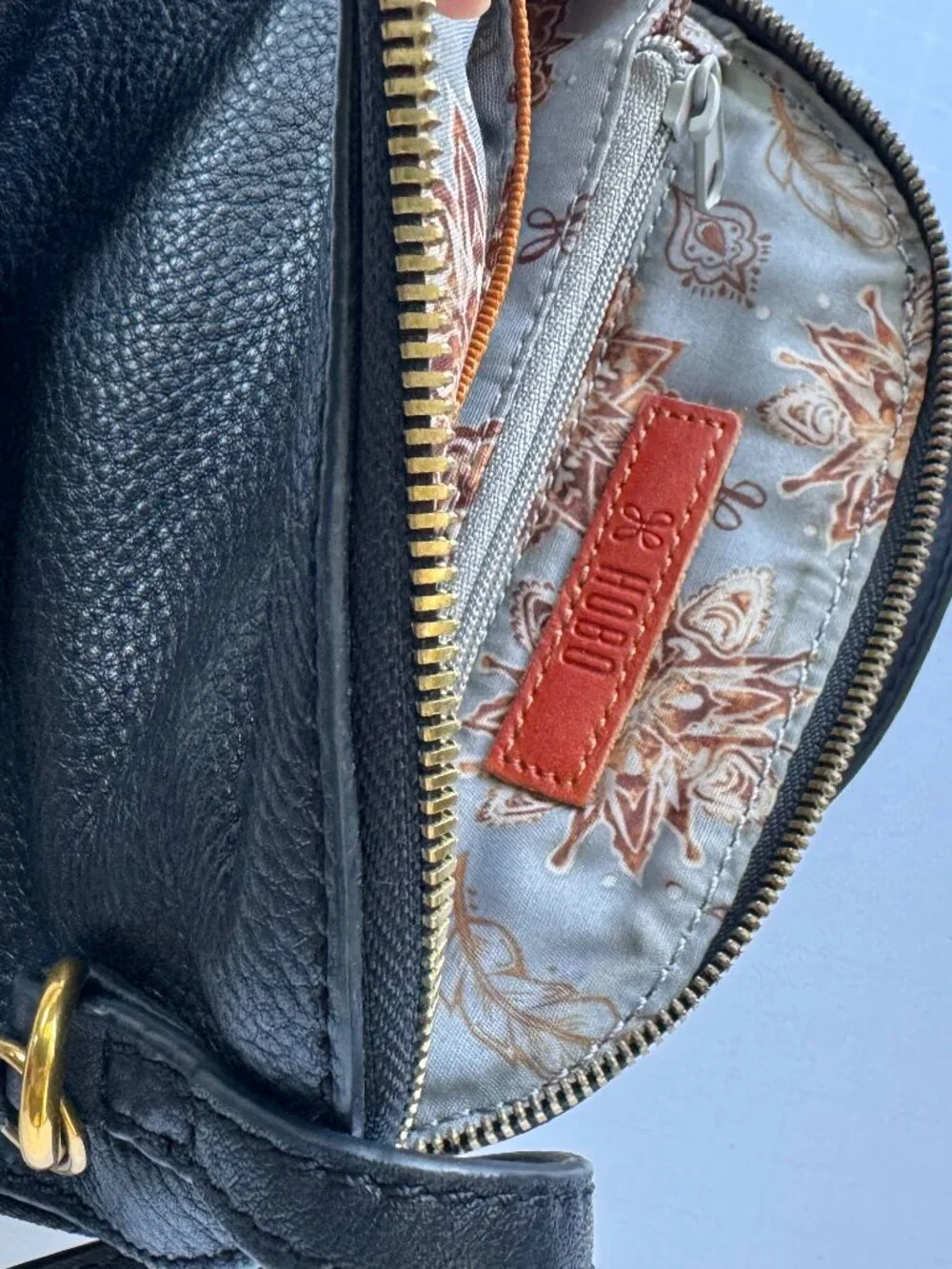 HOBO | Nash | Black Pebbled Leather Crossbody Bag with Tassel